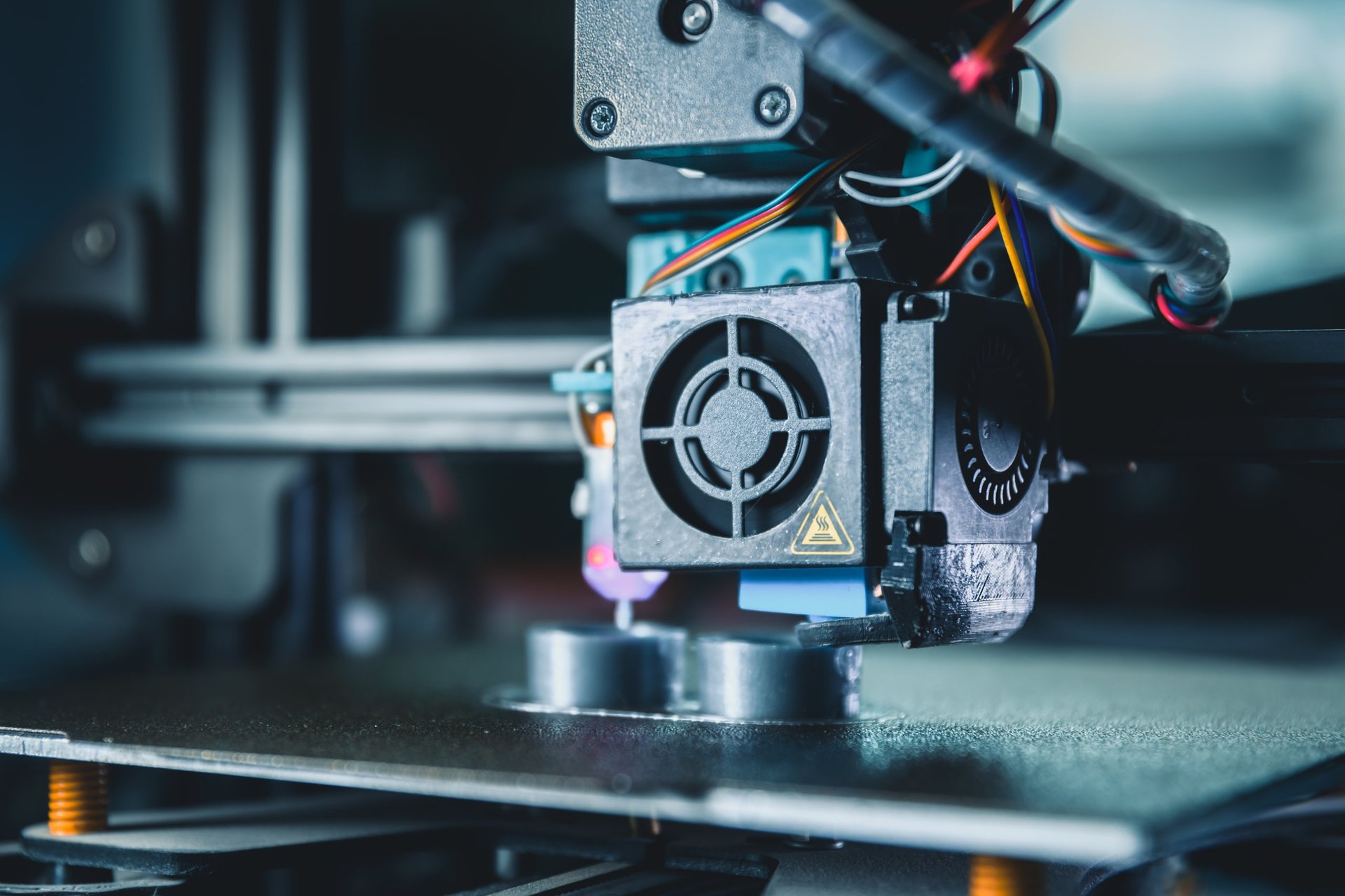 Modern 3d printer producing a new prototype model with melted material in an engineering laboratory