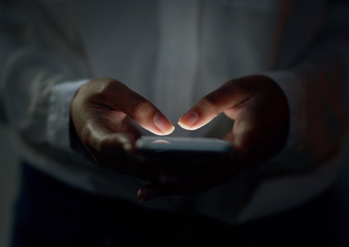 Cropped shot of an unrecognizable woman using a cellphone